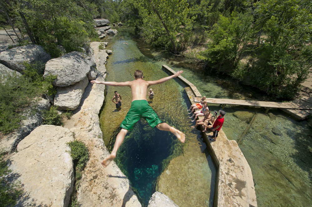 Karst springs make iconic swimming holes (Jacobs Well).